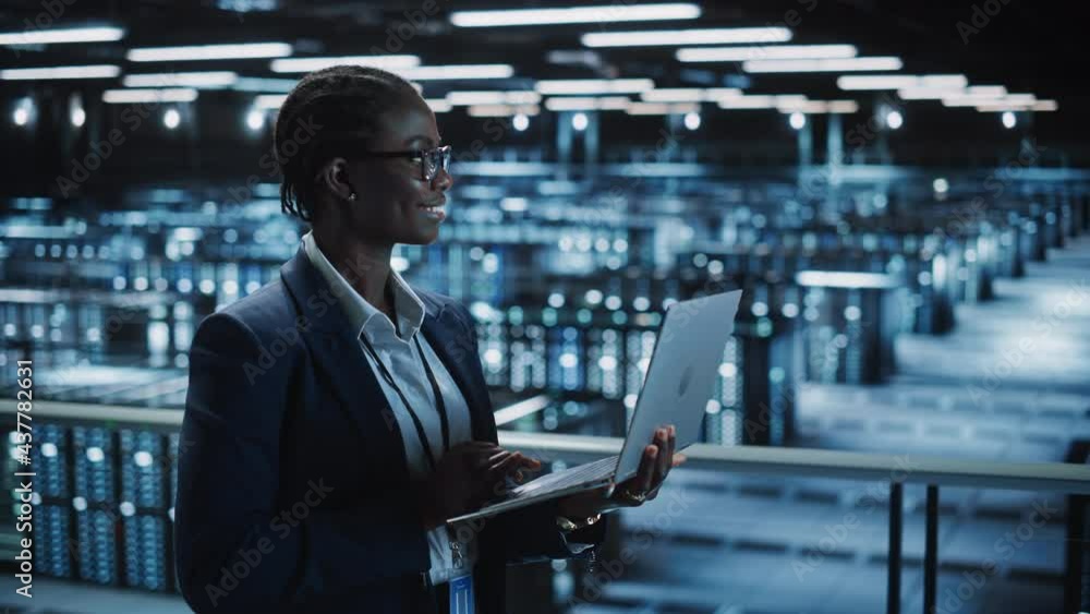 Data Center Female Programmer Using Laptop Computer, Maintenance IT ...