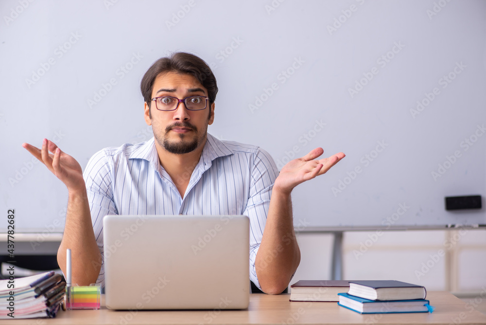 Young male teacher in telestudying concept Young male teacher in telestudying concept