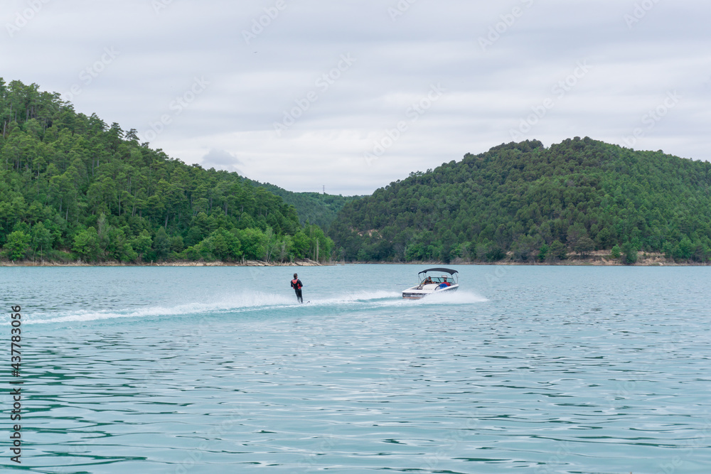 Man practicing water skiing in the San Ponç reservoir