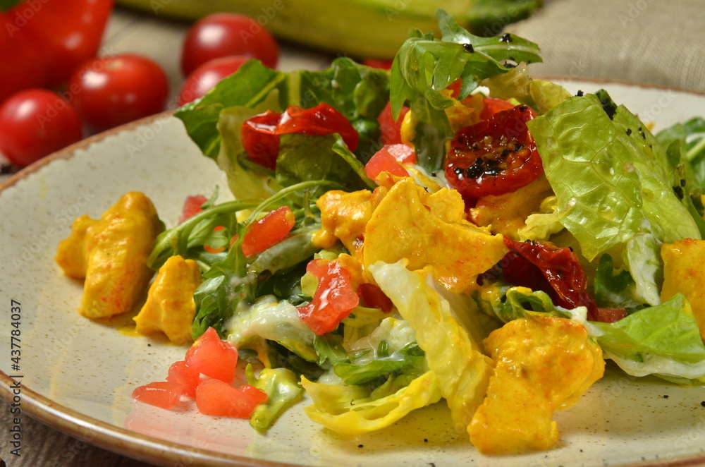 warm fresh salad with tomatoes and kurry chicken