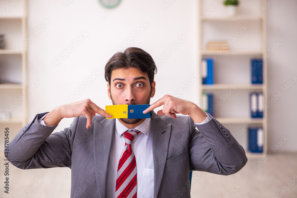 Young businessman employee in ecommerce concept Young businessman employee in ecommerce concept