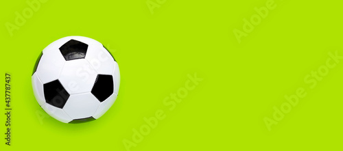 Soccer ball on green background. Top view