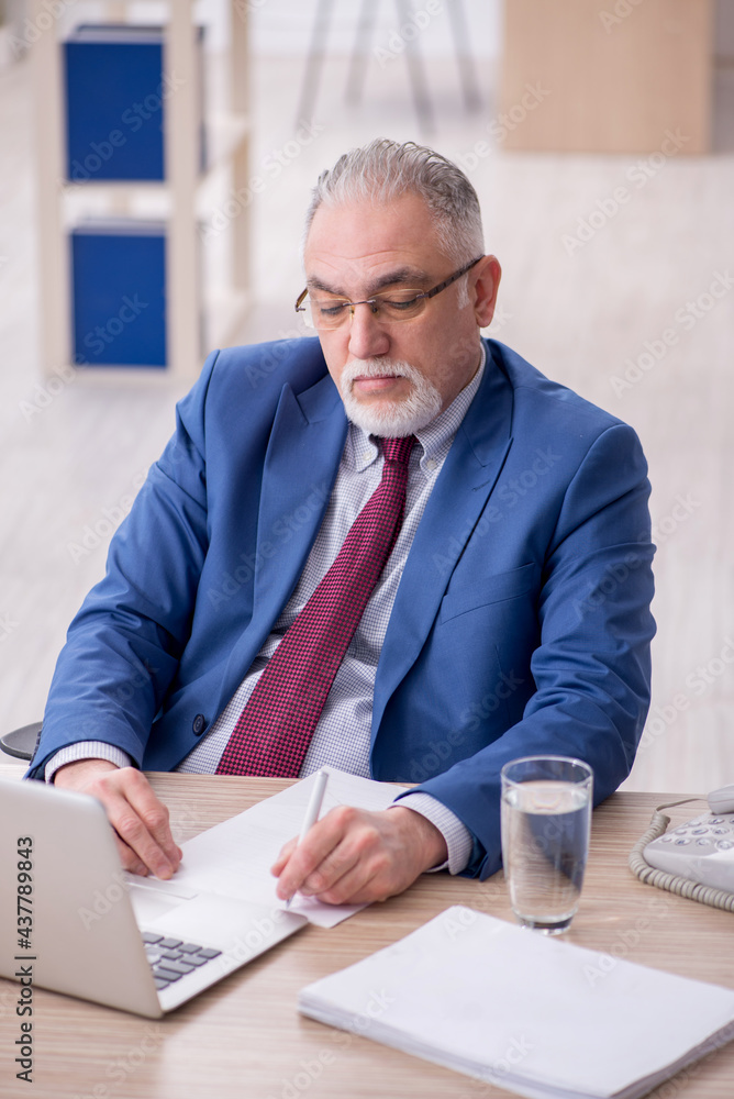 Old male employee and too much work in the office Old male employee and too much work in the office