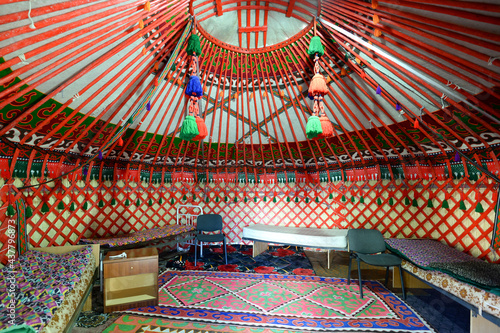 Inside view of a yurt in Bokonbayevo, Kyrgyzstan. Circular tent used as a house by dungan and nomadic groups in Central Asia. Ger interior. photo