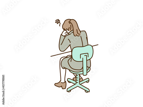 机で落ち込むビジネスウーマン