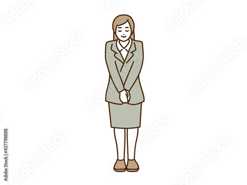 正面で挨拶するビジネスウーマン