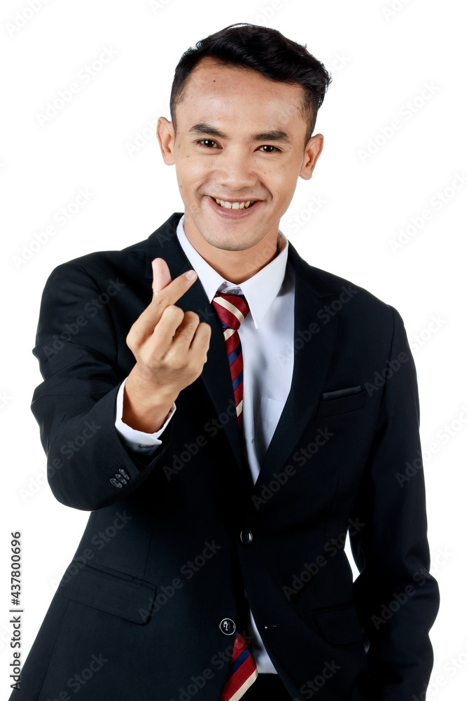 Young attractive asian business man wearing black suit with white shirt and necktie doing the mini heart pose and smiling and looking confident. white background isolated Young attractive asian business man wearing black suit with white shirt and necktie doing the mini heart pose and smiling and looking confident. white background isolated