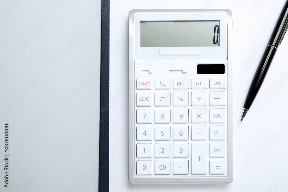 Calculator, clipboard and pen on white background, top view. Space for text Calculator, clipboard and pen on white background, top view. Space for text
