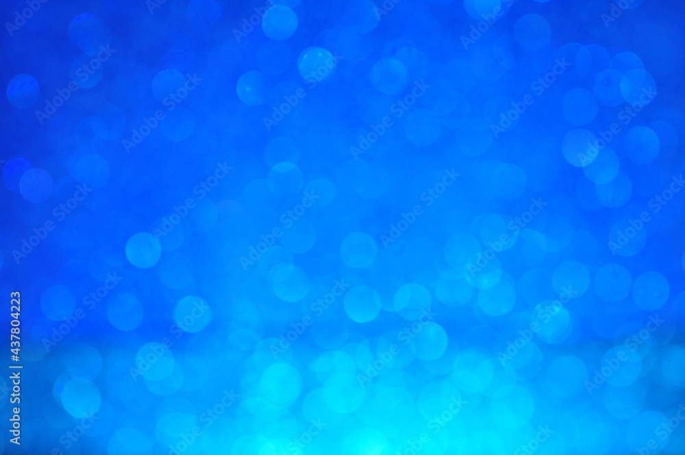 Abstract blue bokeh glitter on nature background Abstract blue bokeh glitter on nature background