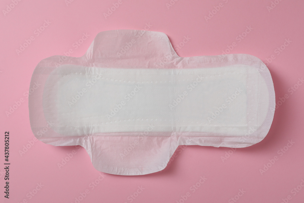Sanitary napkin on pink background, top view. Gynecology concept Sanitary napkin on pink background, top view. Gynecology concept