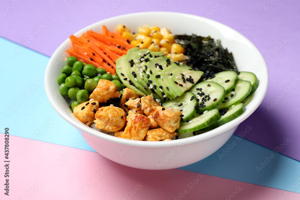 Delicious salad with chicken and vegetables on color background, closeup Delicious salad with chicken and vegetables on color background, closeup