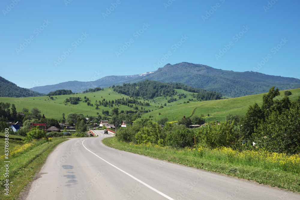 Countryside road, village in Altai mountains, summer
