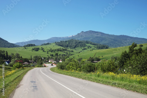 Countryside road, village in Altai mountains, summer