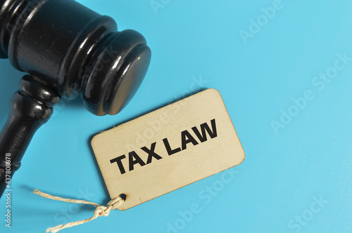 Top view of judge gavel and label tag written with TAX LAW