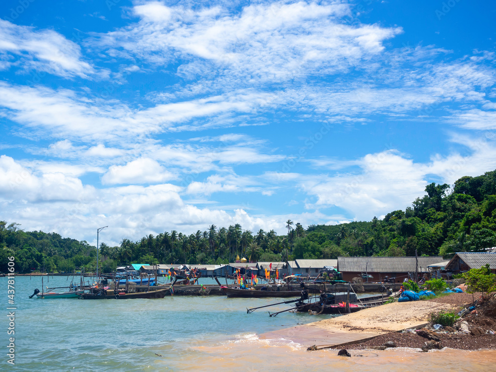 Beautiful seascape summer background. Scene of fisherman village with many local longtail boat on the sea and sky background on a sunny day in Thailand. Beautiful seascape summer background. Scene of fisherman village with many local longtail boat on the sea and sky background on a sunny day in Thailand.