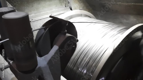 Wire making machine. Rotating parts of production equipment. Old factory.
