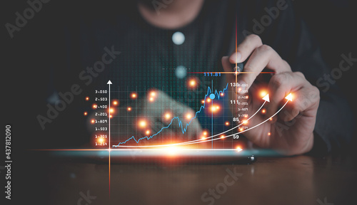 Investor touching growth graph chart and data business strategy digital marketing and payment on digital virtual screen analyze planning business and financial growth up concept.