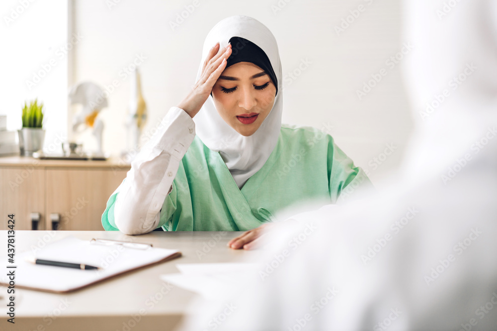 Muslim asian woman doctor service help support discussing and consulting talk to muslim woman patient at meeting health medical care express trust concept in hospital.healthcare and medicine Muslim asian woman doctor service help support discussing and consulting talk to muslim woman patient at meeting health medical care express trust concept in hospital.healthcare and medicine
