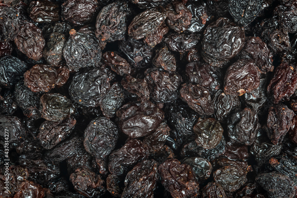 Raisins as background Grape Raisin texture. Top view. Macro photography. Raisins as background Grape Raisin texture. Top view. Macro photography.