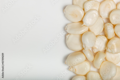 Dried maize mote on white background. Top view. Macro photography.