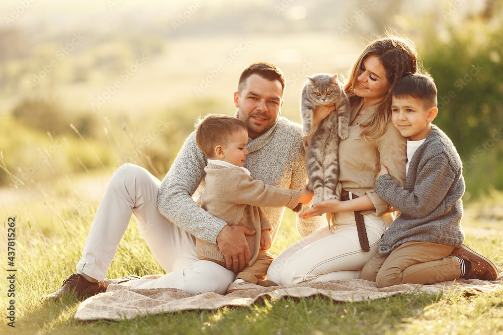 Cute family playing in a summer field