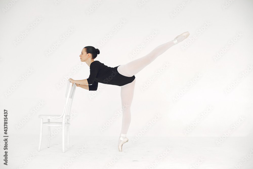 Ballerina posing in front of white background Ballerina posing in front of white background