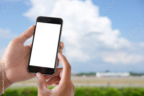 Close up view of businessman holding mock up smart phone with blank screen. 