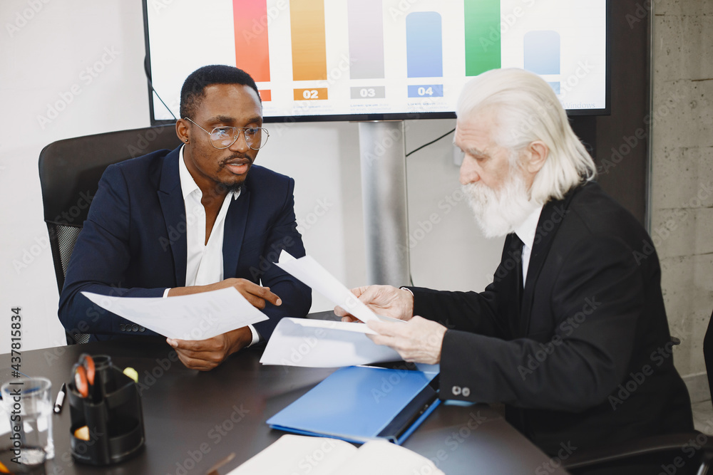 Two busines partners men in the office Two busines partners men in the office