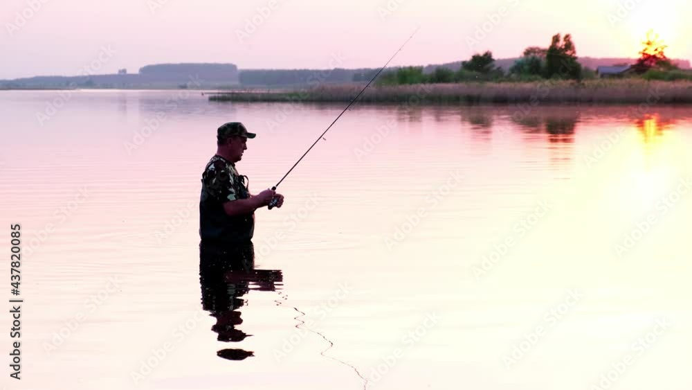 Silhouette of a fisherman, a man fishing in the river at sunset. Silhouette of a fisherman, a man fishing in the river at sunset.