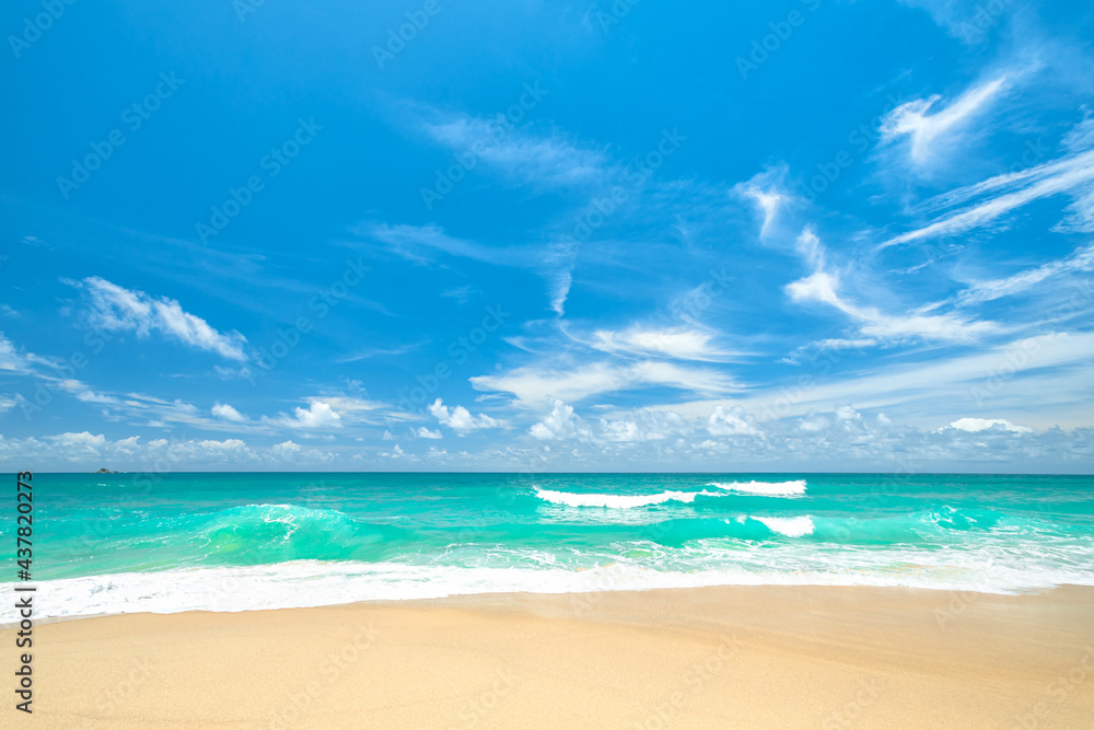 Fototapeta premium Clean sandy beach, with blue waves and blue sky, beautiful scene of the sea at summer beach of Phuket, Thailand. Travel vacation holiday design concept.