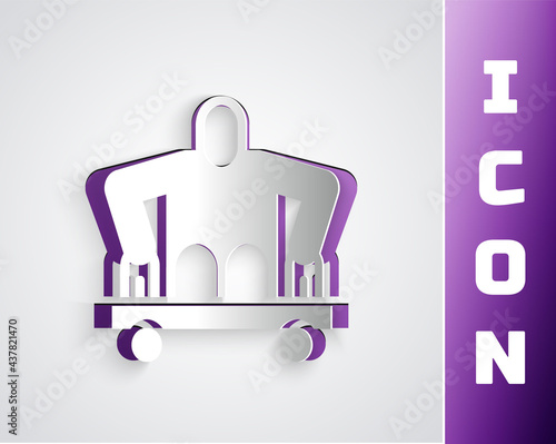 Paper cut Man without legs sitting wheelchair icon isolated on grey background. Disability concept. Guy with physical disabilities. Paper art style. Vector