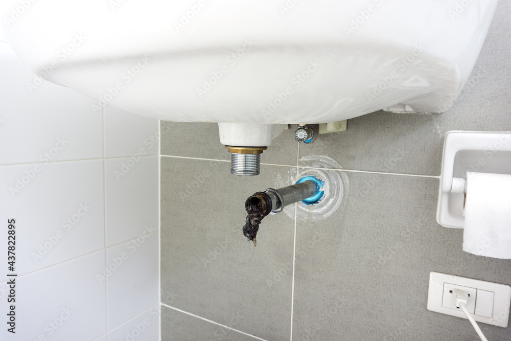 Dirty Clogged in waste pipe of Basinsink. Washbasin Drain Clogging up with hair fall, dust