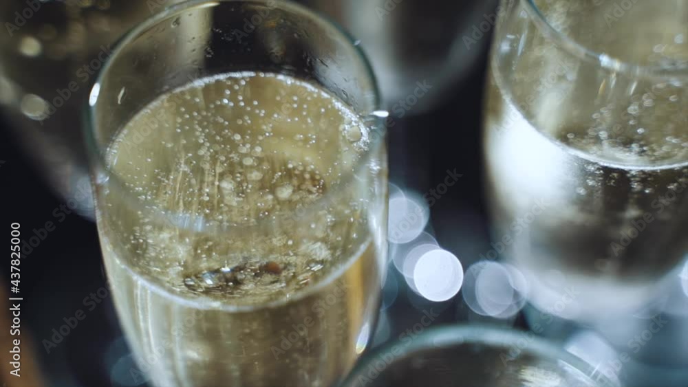 Champagne bubbles in glasses in slow motion Champagne bubbles in glasses in slow motion