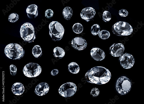 Large gemstones and small gemstones isolated on black background.