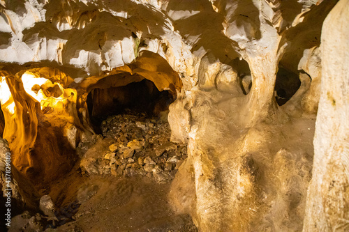 Inside view of Karain Cave in Antalya, with natural stalactites and stalagmites around in Turkey photo