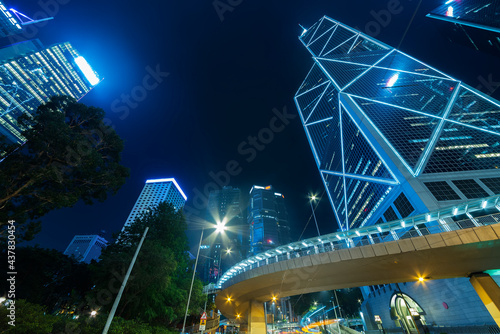 Light trail of traffic and skyscraper in downtown district of Hong Kong city at night