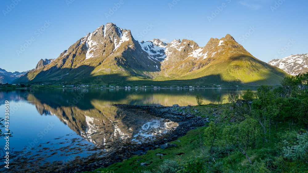 Beautiful Nature Norway natural landscape with mountain reflection on a lake.