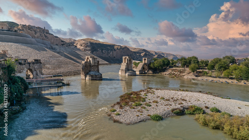 Hasankeyf, Turkey - October 2019: Remains of the town of Hasankeyf on the River Tigris, famous with stone caves after it is evacuated. The town will be sunk under water of ilisu dam photo