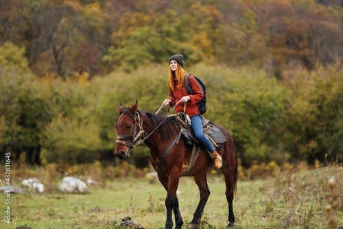Woman riding horse outdoors fresh air travel landscape