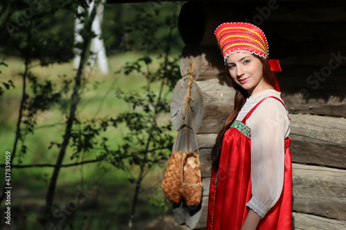 girl in traditional dress wooden wall