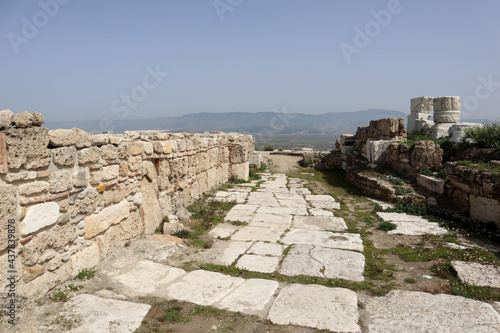 street with white marble pavement among ruins of the ancient city Laodicea in Turkey