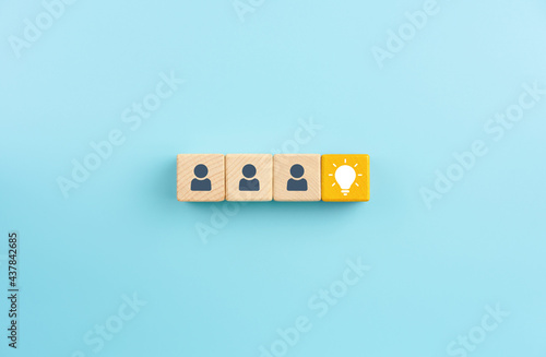 Yellow wooden blocks with light bulb icon and Businessman icons, Brainstorming, innovation and solution concept