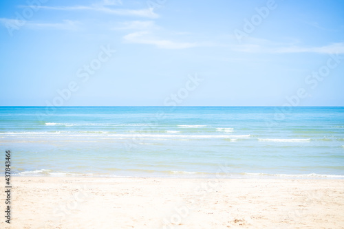 Sand beach soft wave at coast with blue sea and blue sky. nature ocean outdoor. tropical tourist vacation summer travel in holidays concept.