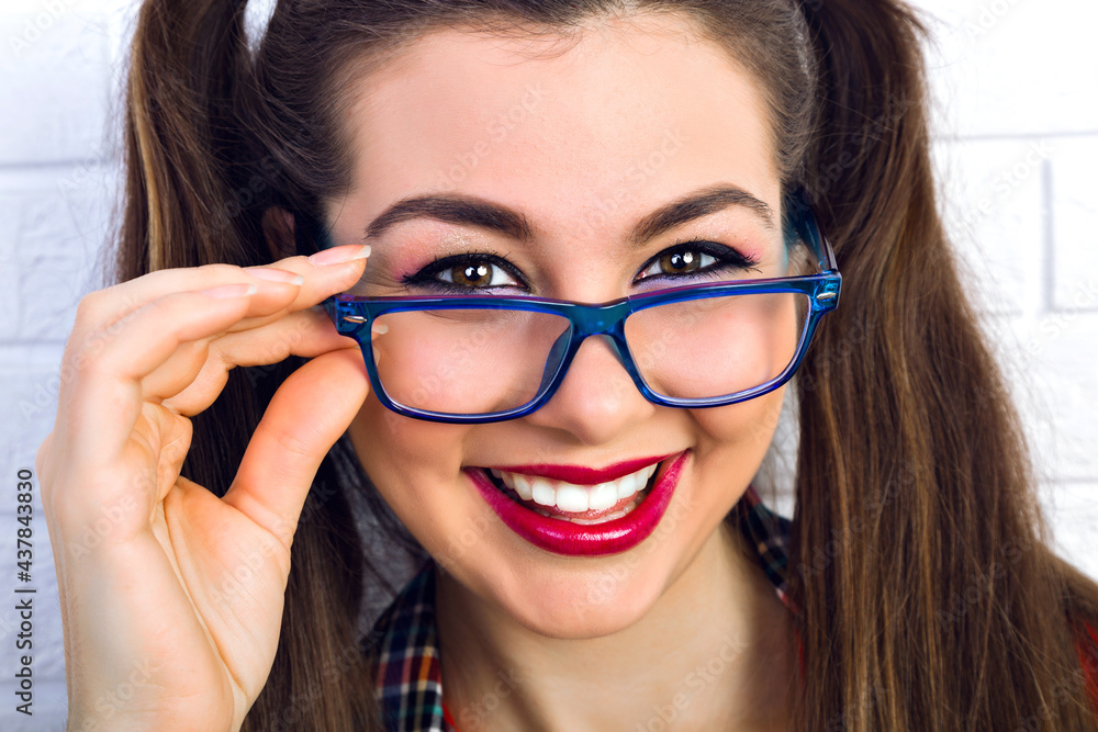 Fashion indoor portrait of young happy smiling pretty hipster teen girl Fashion indoor portrait of young happy smiling pretty hipster teen girl