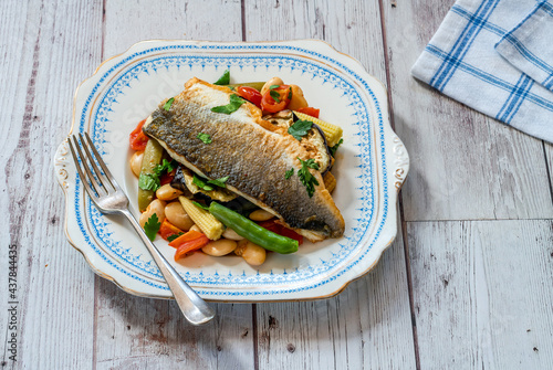 Sea bass with tomato and butter bean ragout