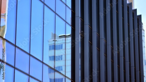 Wallpaper Mural Modern architecture with sun ray. Glass and steel facade on a bright sunny day with sunbeams on the blue sky. Economy, finances, business activity concept. Torontodigital.ca