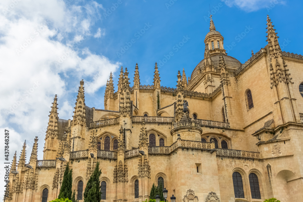 Majestic detailed front view at the iconic spanish gothic ornaments building at the Segovia cathedral, towers and domes