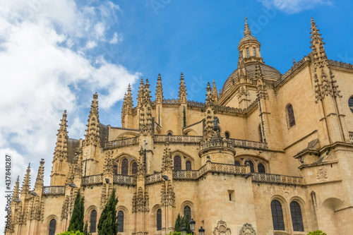 Majestic detailed front view at the iconic spanish gothic ornaments building at the Segovia cathedral, towers and domes