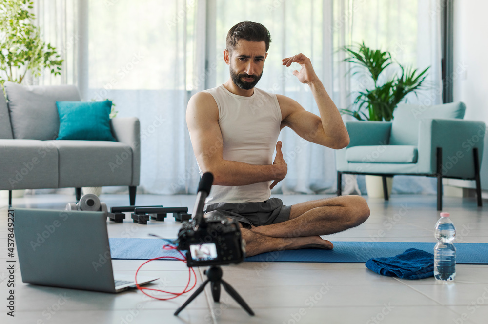 Professional vlogger recording a workout video Professional vlogger recording a workout video