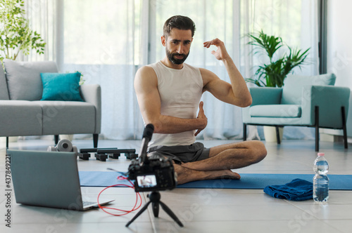 Professional vlogger recording a workout video